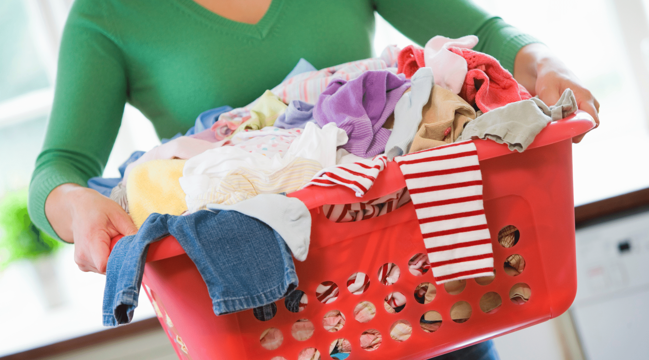 woman carrying a heavy basket of laundry - body alignment and dra