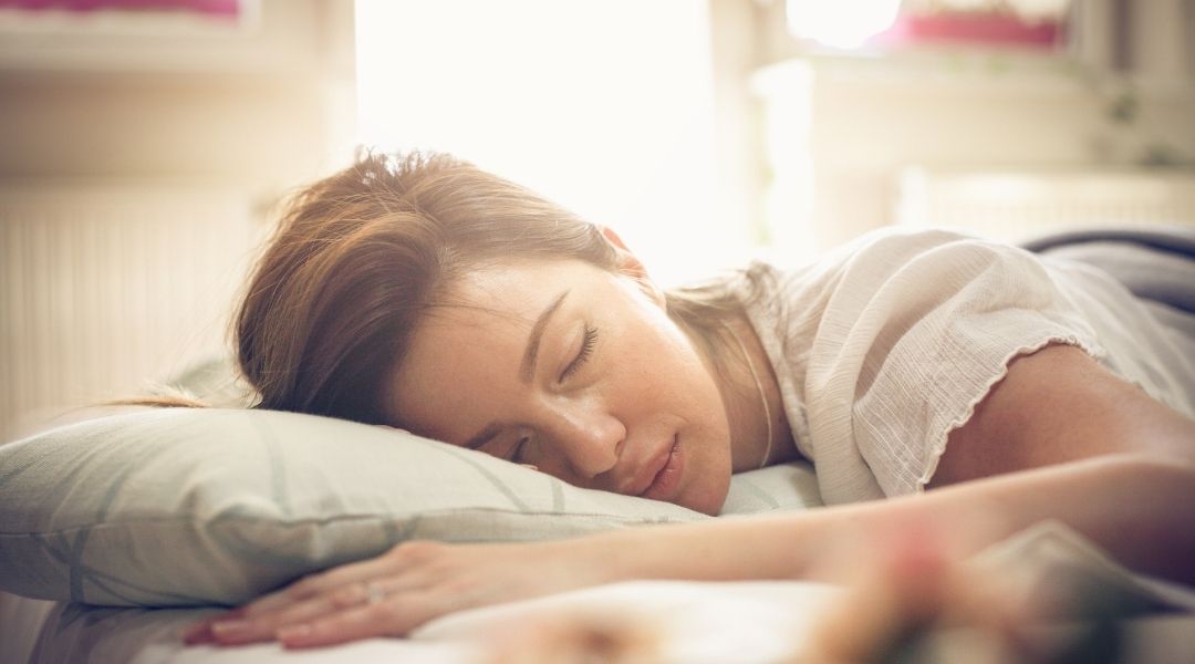 Woman sleeping peacefully - the importance of sleep