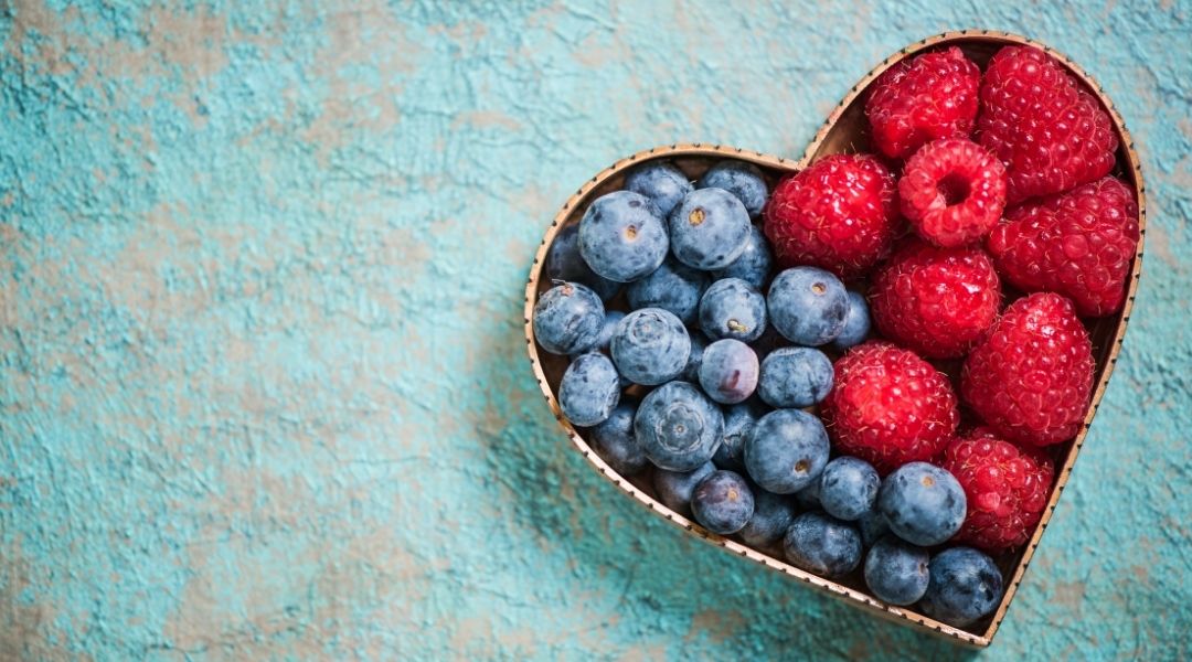 blueberries and raspberries arranged in a heart shaped cookie cutter - Nutrition tips