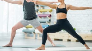 two people in warrior pose - here's what a healthy pelvic floor looks like 