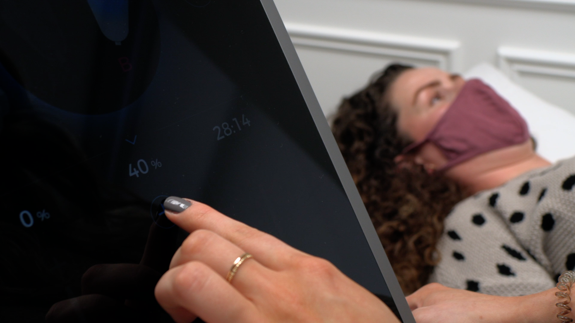 Close image of Emsculpt controls with woman in the background - Corelife Wellness Better Core Fitness